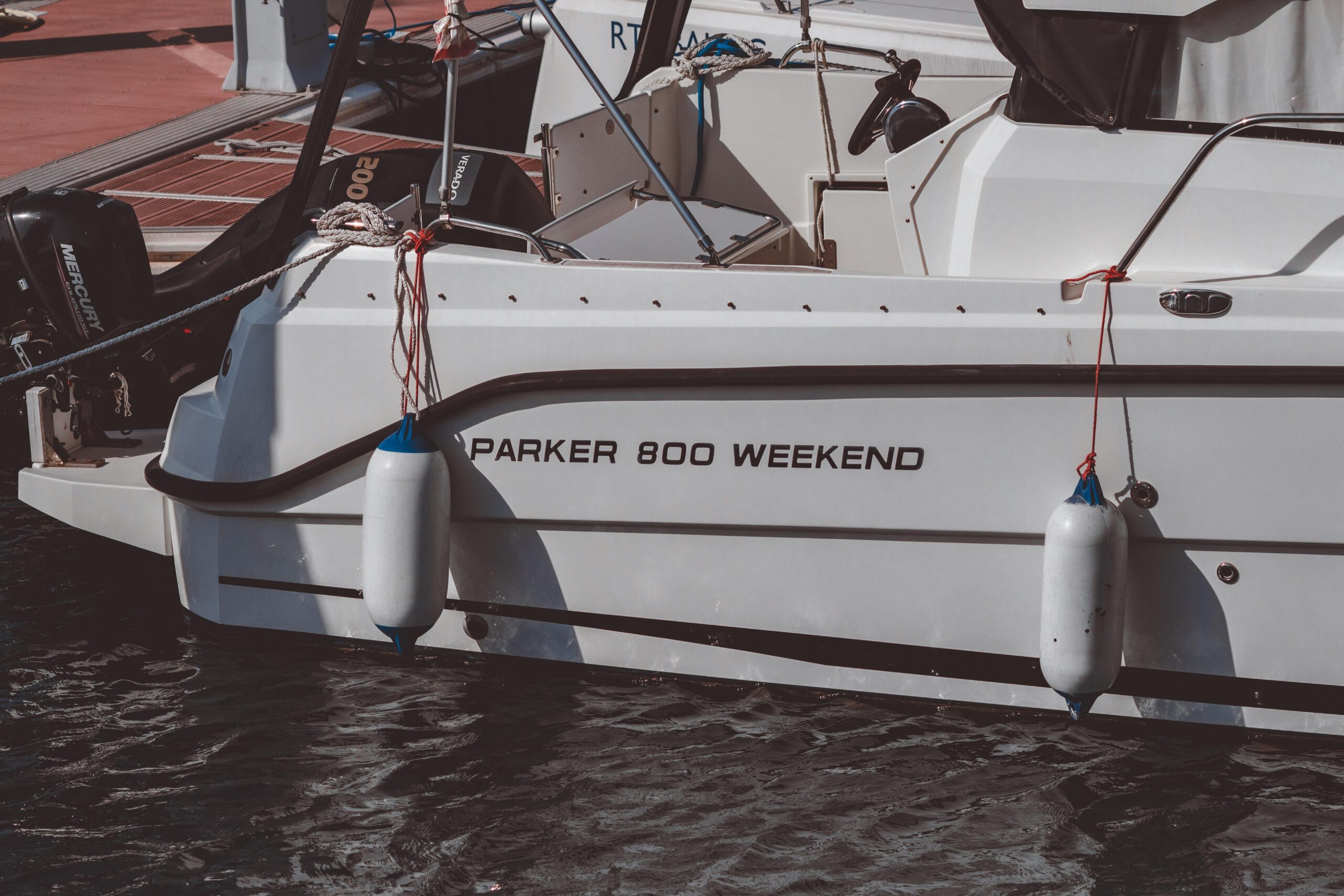 Close-up of a Parker 800 Weekend motorboat docked at Famagusta marina, capturing nautical details.